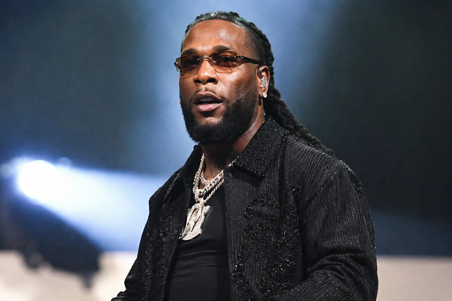 Nigerian Afrobeats star Burna Boy performs on stage as he becomes the first African artist to surpass 50 million monthly listeners on Spotify.