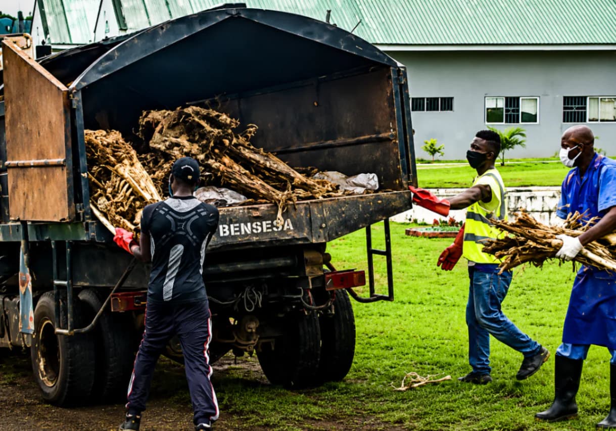 Workers appear to move unclaimed human remains for mass burial at a Benue hospital