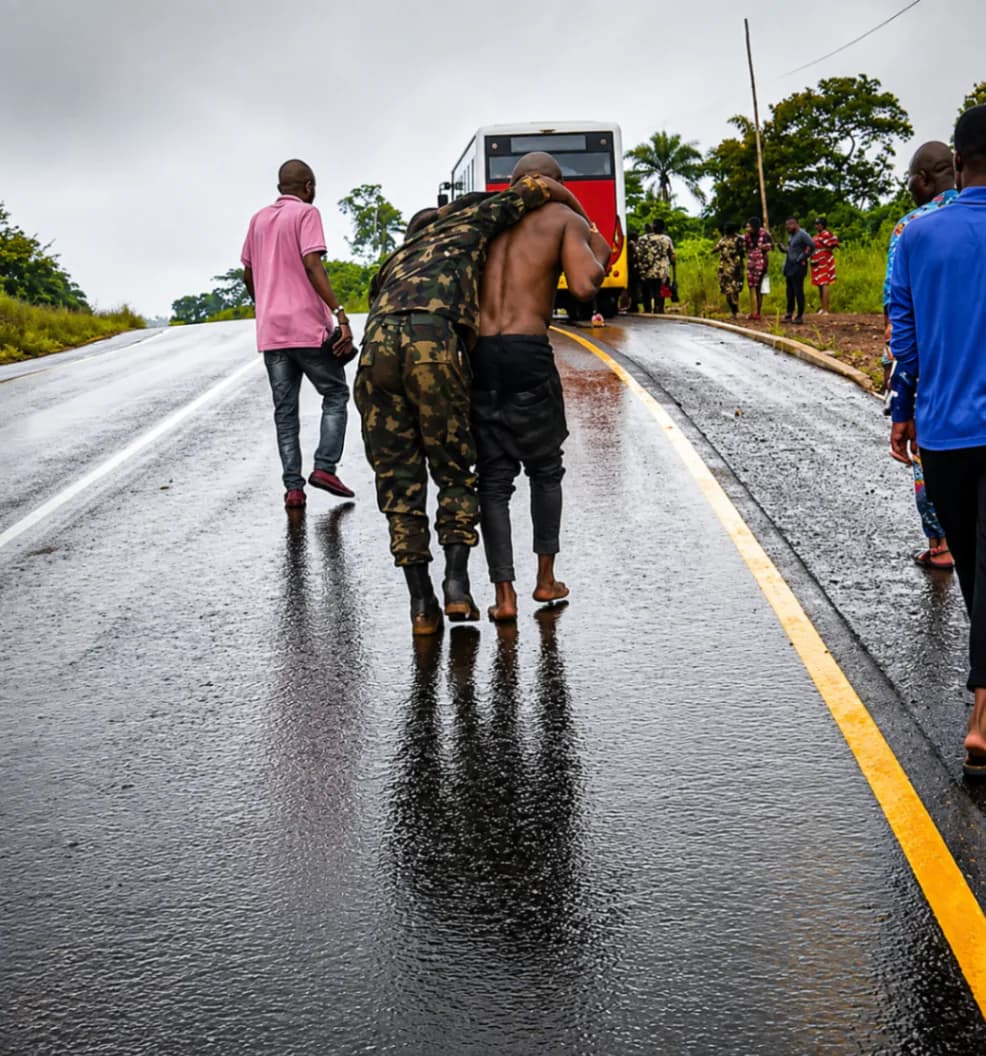 Civilians help injured Nigerian soldiers after military truck crash on Ohafia Road