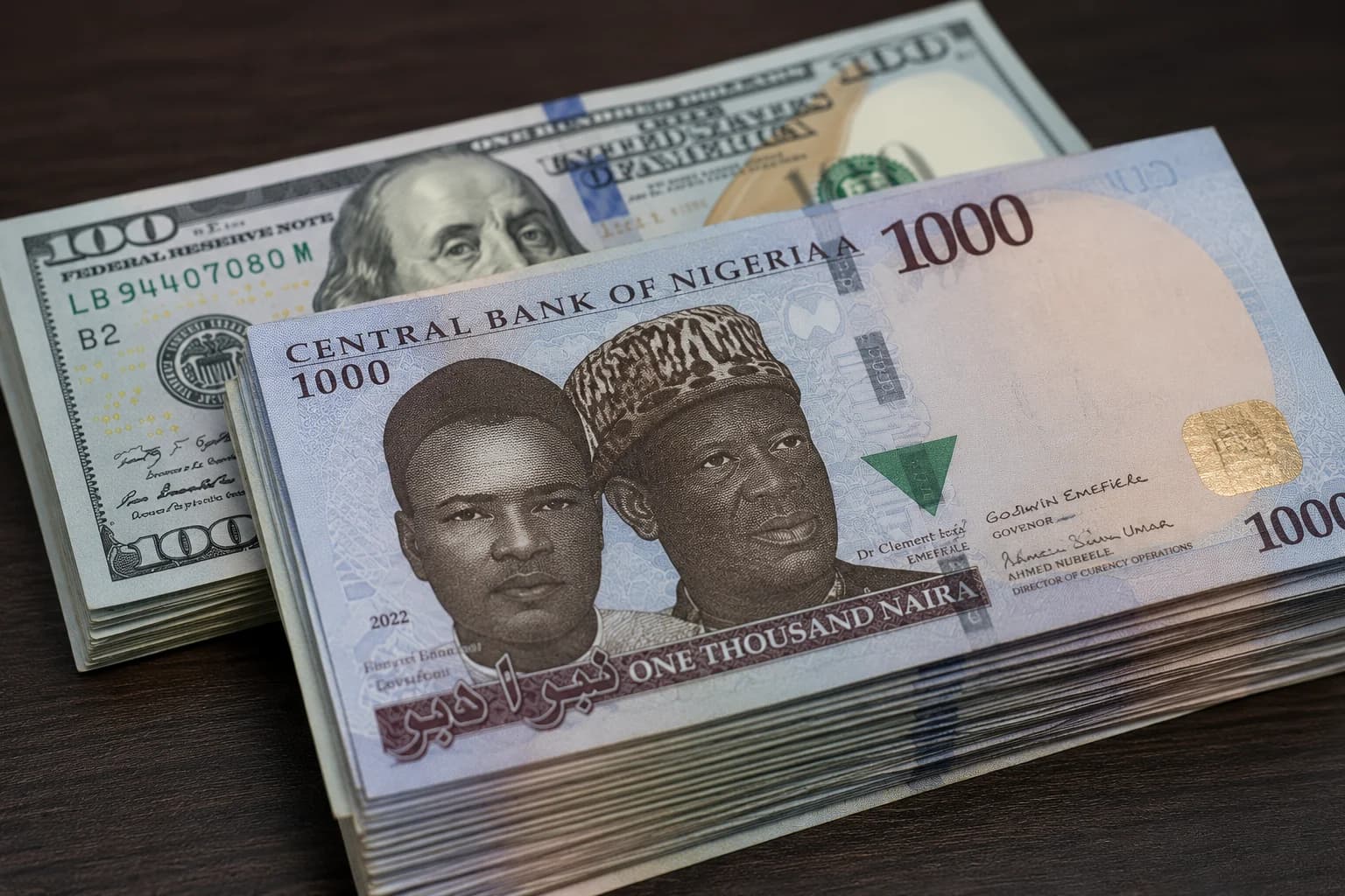 Nigerian naira banknotes alongside US dollar bills representing exchange rate stability.