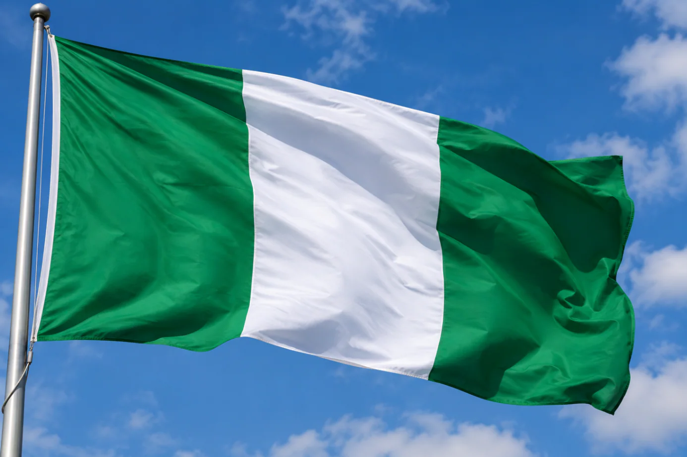 Nigerian naira notes and food items representing inflation and rising food prices